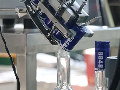 Cap Placement Mechanism